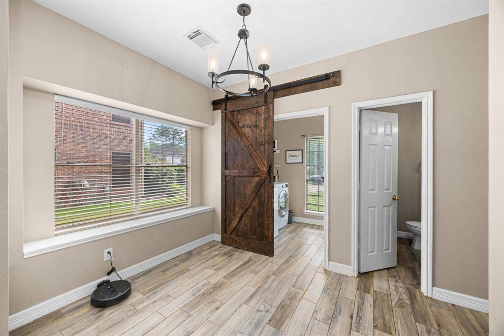 Cute barn door to laundry room.