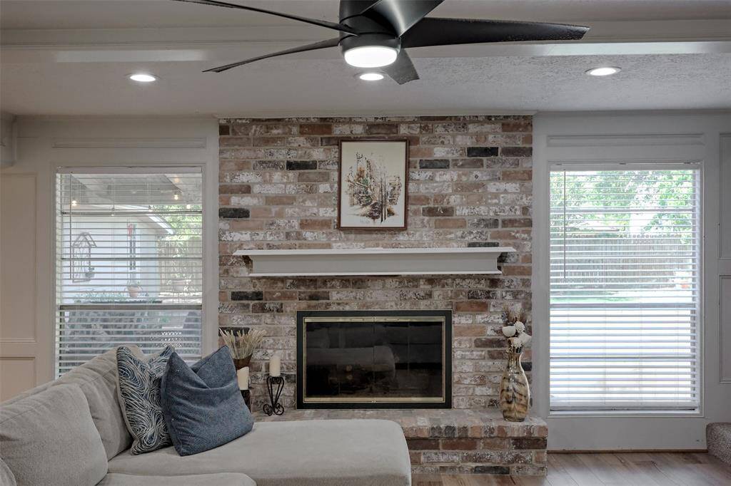 Plenty of Natural Lighting in the Living Room with recessed Canned lighting and updated modern ceiling fan.