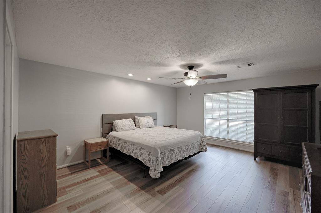 Primary Bedroom located downstairs offers plenty of space to make this a retreat of your own.