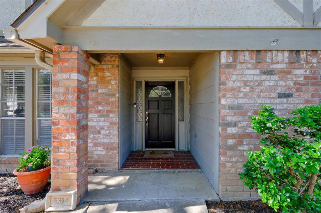 Solid Wood Front Door I welcomes you into the foyer.