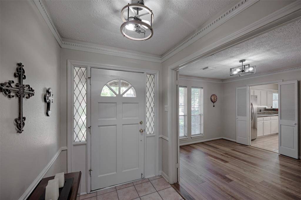 Updated Lighting in the Foyer and Dining Room.
