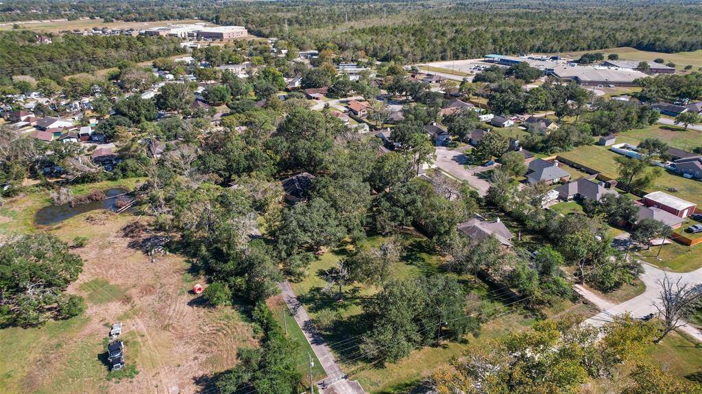 Though the aerial photo shows this rural 1.94-acre property with plenty of shade trees, you may be surprised to find that this hidden gem is just a mile and a half from the Gulf Freeway corridor, making for easy access to work, shopping, and dining.