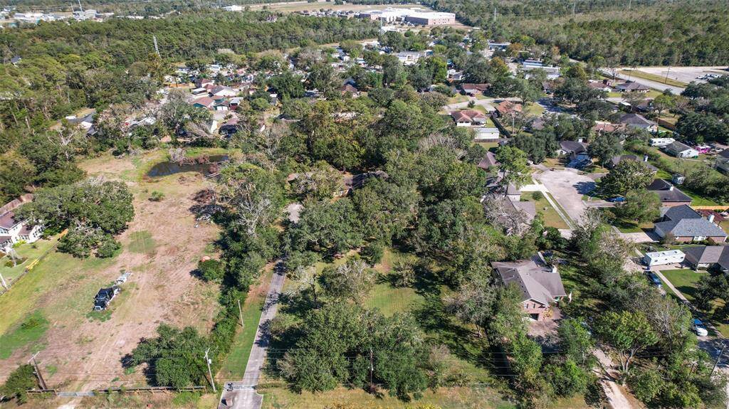 Though the aerial photo shows this rural 1.94-acre property with plenty of shade trees, you may be surprised to find that this hidden gem is just a mile and a half from the Gulf Freeway corridor, making for easy access to work, shopping, and dining.