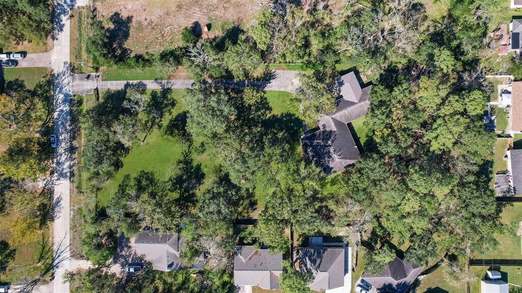 Though the aerial photo shows this rural 1.94-acre property with plenty of shade trees, you may be surprised to find that this hidden gem is just a mile and a half from the Gulf Freeway corridor, making for easy access to work, shopping, and dining.