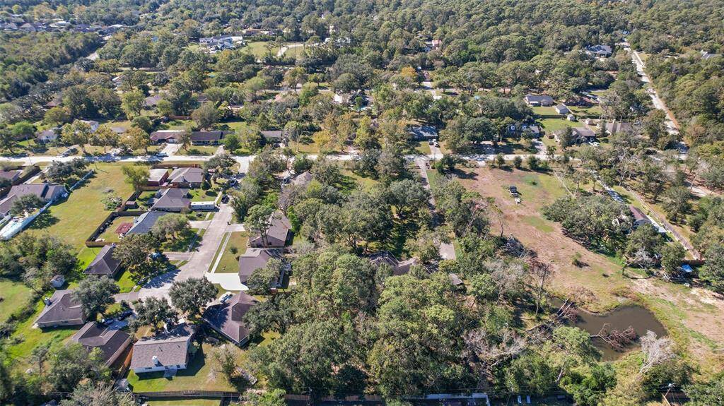 Though the aerial photo shows this rural 1.94-acre property with plenty of shade trees, you may be surprised to find that this hidden gem is just a mile and a half from the Gulf Freeway corridor, making for easy access to work, shopping, and dining.