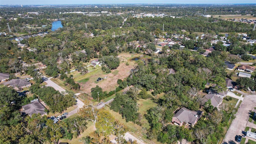 Though the aerial photo shows this rural 1.94-acre property with plenty of shade trees, you may be surprised to find that this hidden gem is just a mile and a half from the Gulf Freeway corridor, making for easy access to work, shopping, and dining.