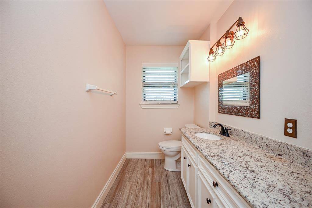 The current guest bathroom is a renovated former full bathroom and is conveniently accessible to all of the downstairs living spaces