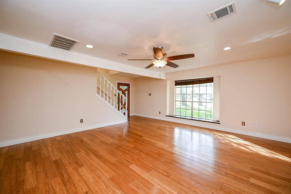 Enter the family room through a hallway or through a second front entry door.