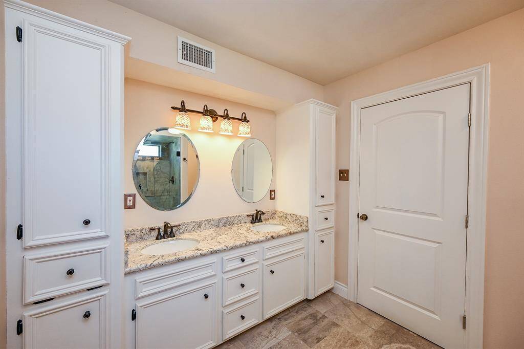 The airiness of the master bathroom sets a happy tone for the day and a sense of relaxation in the evening.  Plenty of bathroom storage only adds to the calm of maintaining organization.