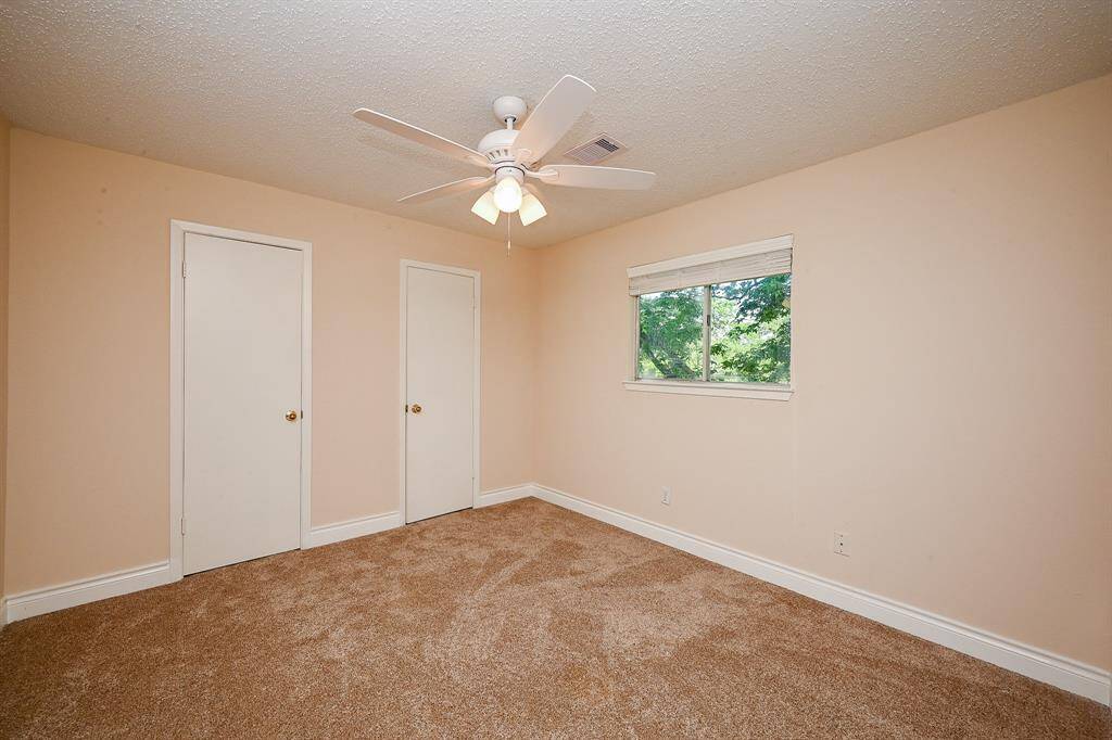 The 3rd secondary bedroom overlooks the backyard.