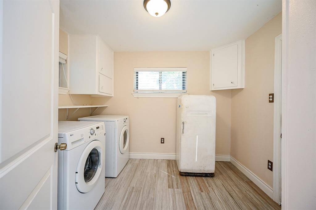 From the garage/carport, the back door leads into the laundry room.  It is large enough to double as a mud room.