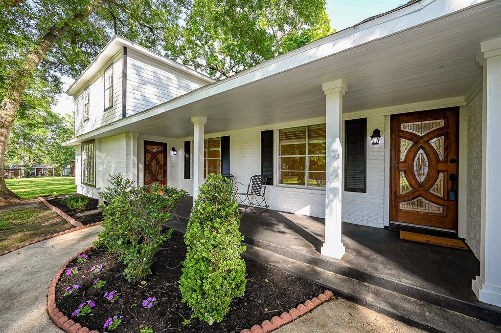 Sit and relax on the large front porch. Beautiful doors welcome family and friends.