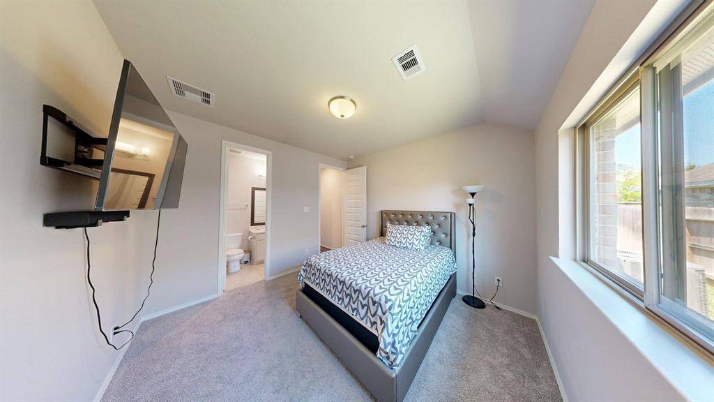 On the left, you have a door to the bathroom straight from this bedroom