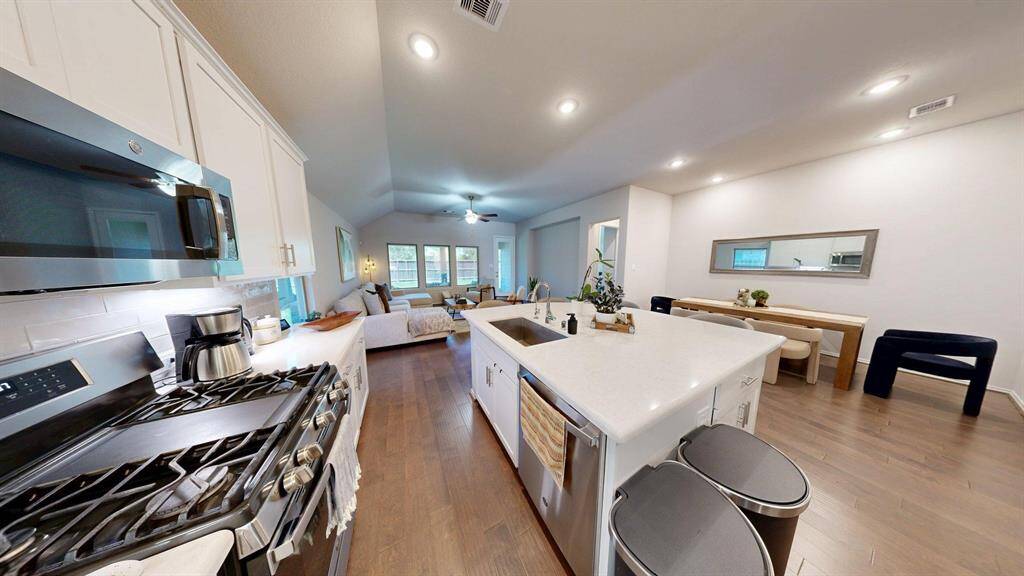 Gas range and microwave with exhaust