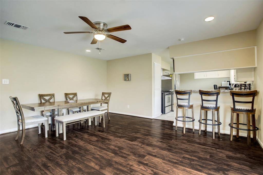 Dining area and handy breakfast bar! Looking toward the remodeled kitchen.
