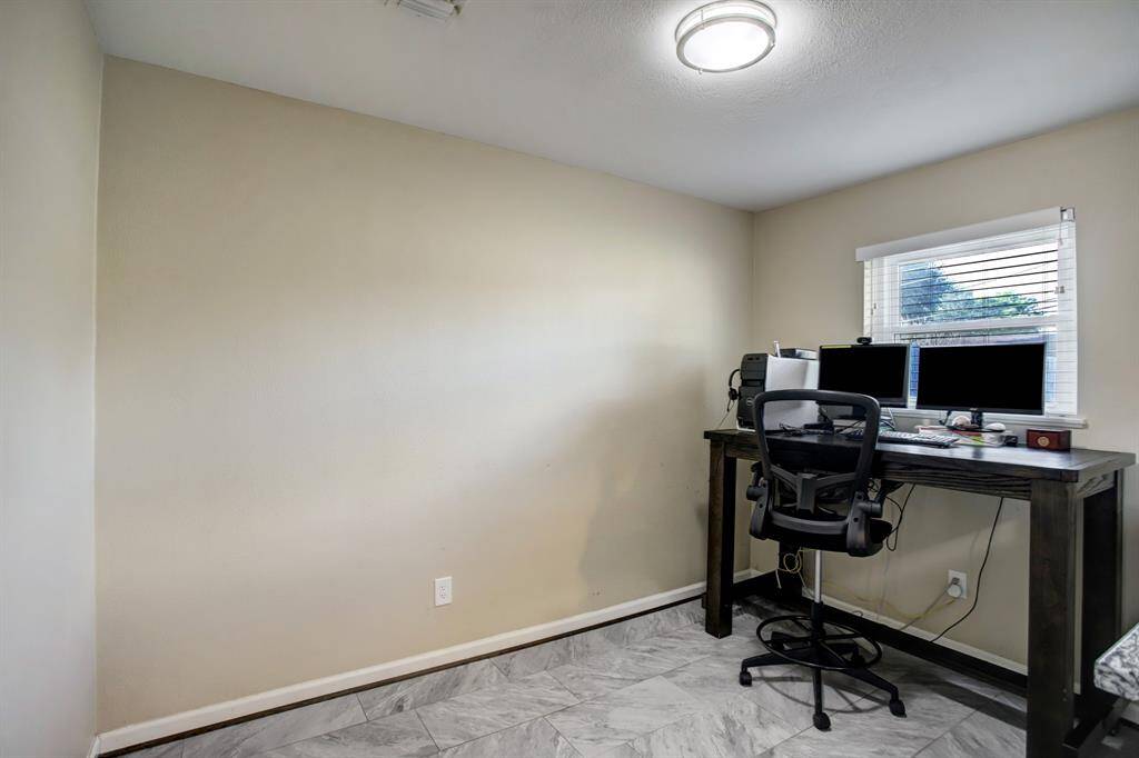 View of breakfast area which is currently being used as a home office work space.