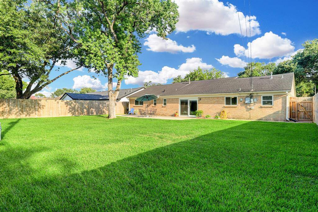 This is the large backyard you have been dreaming about! Plenty of room to add a pool and still have lots of grass space!