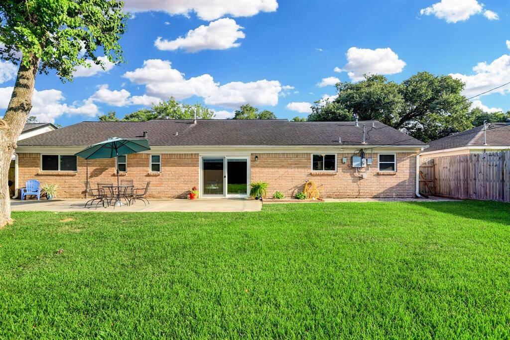 Notice brick on all 4 sides of house! Sliding glass double-paned door leads to family room.