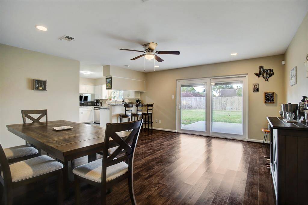 Large open space currently used as a generous size dining area. Ceiling fan. Great view of back yard.