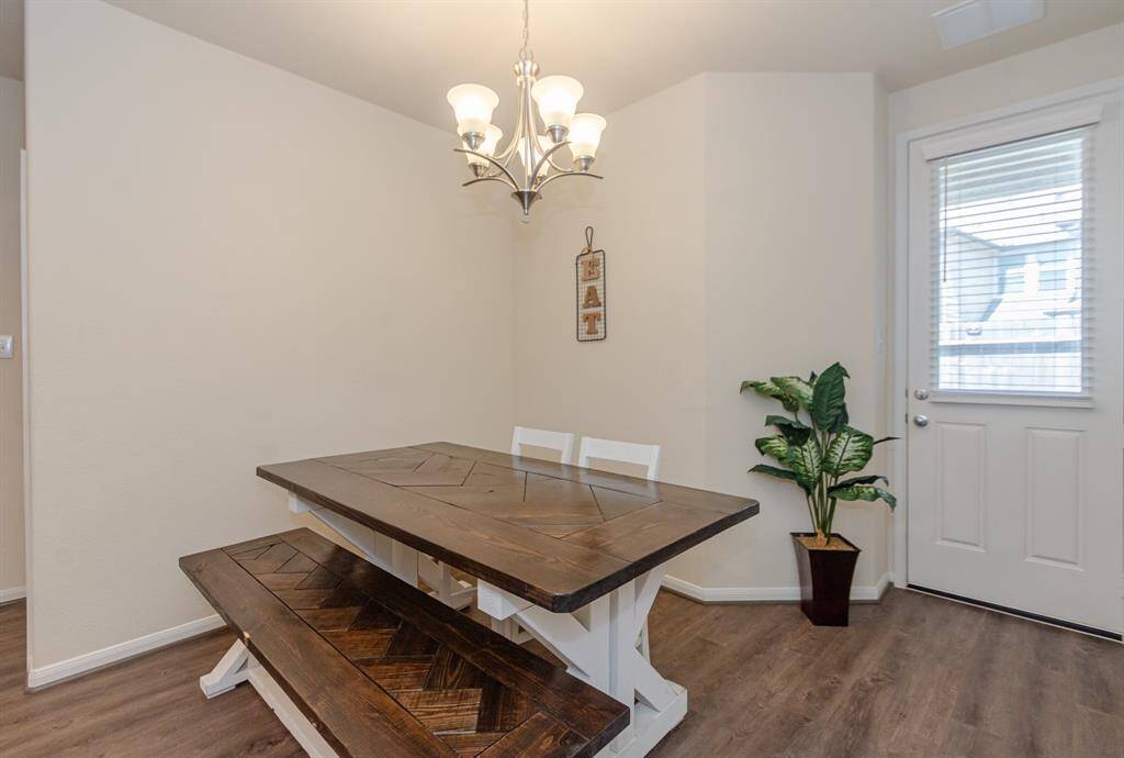 Spacious living room with a seamless view into the modern kitchen.