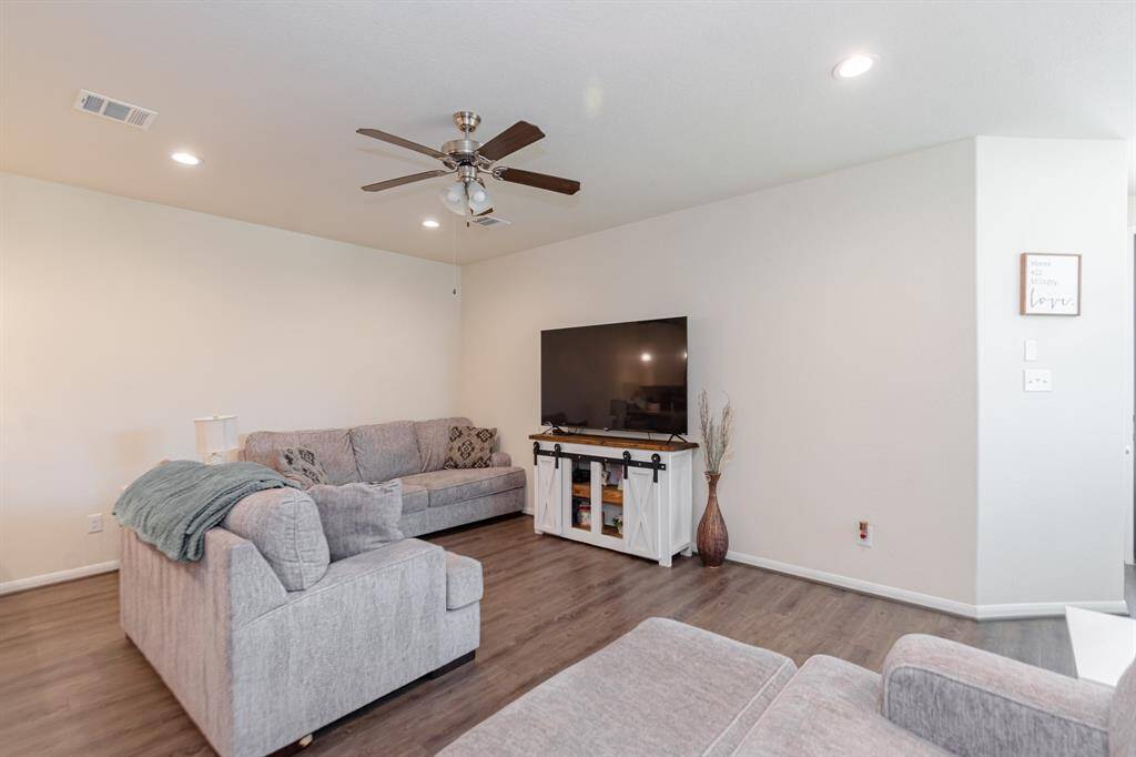 The living room offers a bright, open layout perfect for relaxing or entertaining.