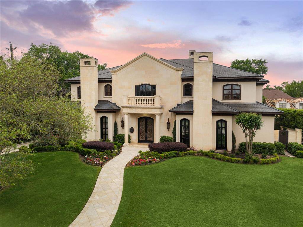 Introducing 5530 Tilbury Dr! Located on a tree-lined street off Tanglewood Boulevard, this custom residence with timeless European inspiration offers grand proportions, soaring ceilings, and a layout designed for ideal living and entertaining.
