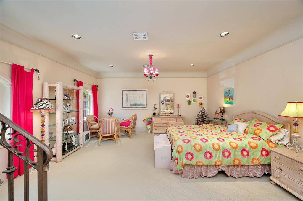 The third floor is the second level of the children’s gamroom, which can also double as an additional bedroom or flex space with a closet and plumbing for a bathroom. The mini doorway pictured leads to the in-wall tunnel system with an additional tunnel access point behind the staircase.
