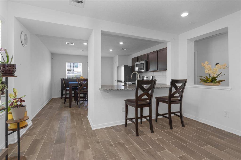 The wood-like tile gives this home a luxurious, yet cozy feel!