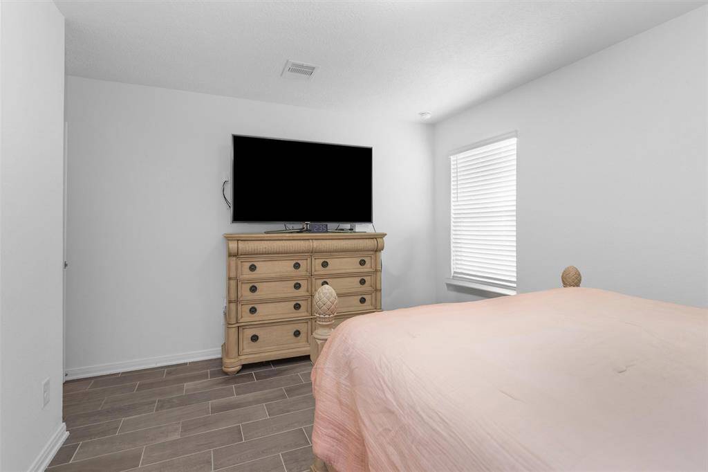 Stunning wood-like tile (no carpet) and a spacious walk in closet!