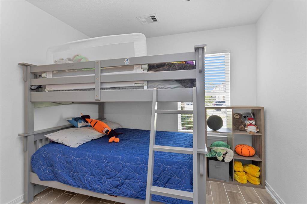 Again, notice the designer wood-like tile in all of the rooms! NO CARPET!