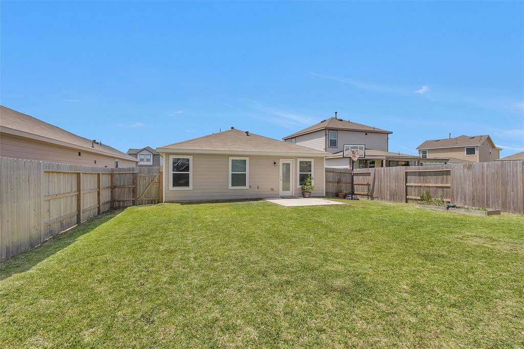 This backyard is ready for a good time - whether that be for your furry family members, your kids, or even your guests!