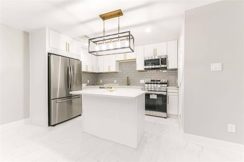 All new kitchen appliances and construction has never been used! This kitchen includes all new stainless-steel appliances, classic gold finishes, immense cabinetry space, a gorgeous granite countertop, spacious pantry for extra storage, and a modern farmhouse chandelier.