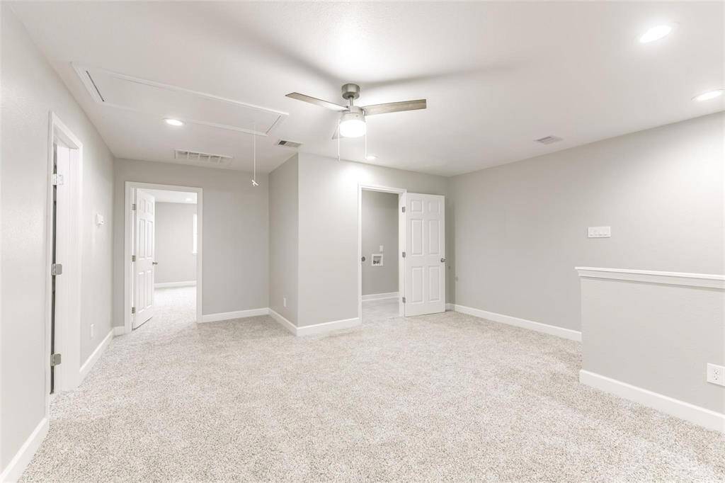 Staircase has easy access to utility room with washer and dryer connections