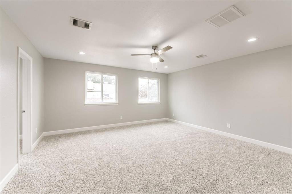 Primary bedroom offers a comforting ambience of natural light and, new recess lighting and modern contemporary fan