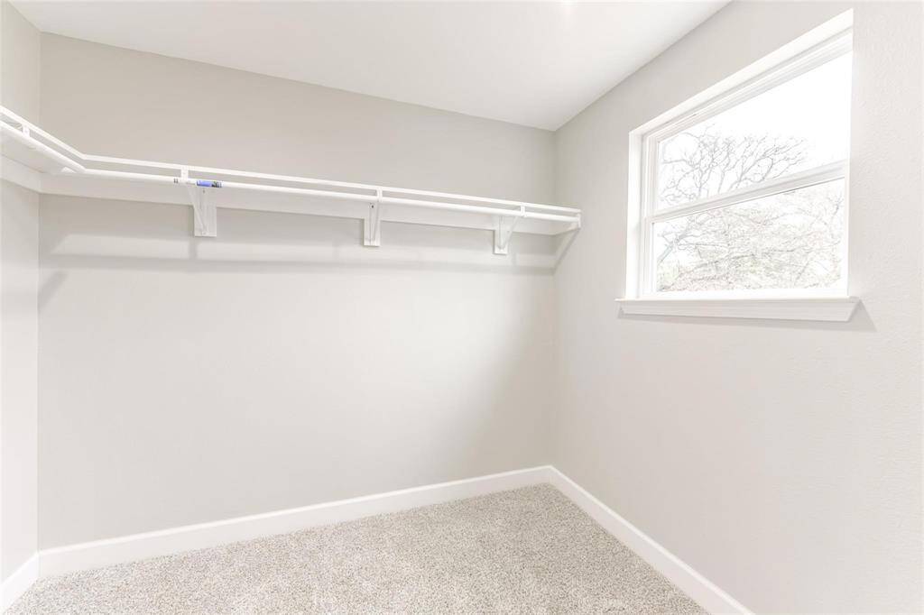 Walk in closet offers a generous amount of space and natural light