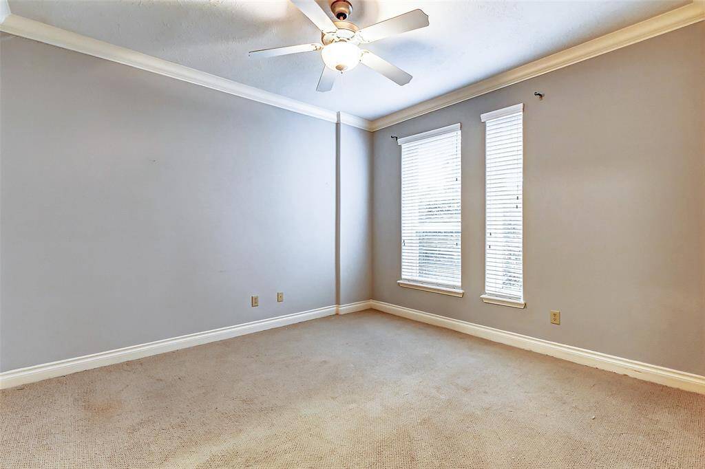 Located on the first floor of thehome is one guest suite thatfeatures berber carpet, crownmolding, soft paint and two brightwindows that overlook the frontof the home. This space coulddouble as a guest suite andhome office