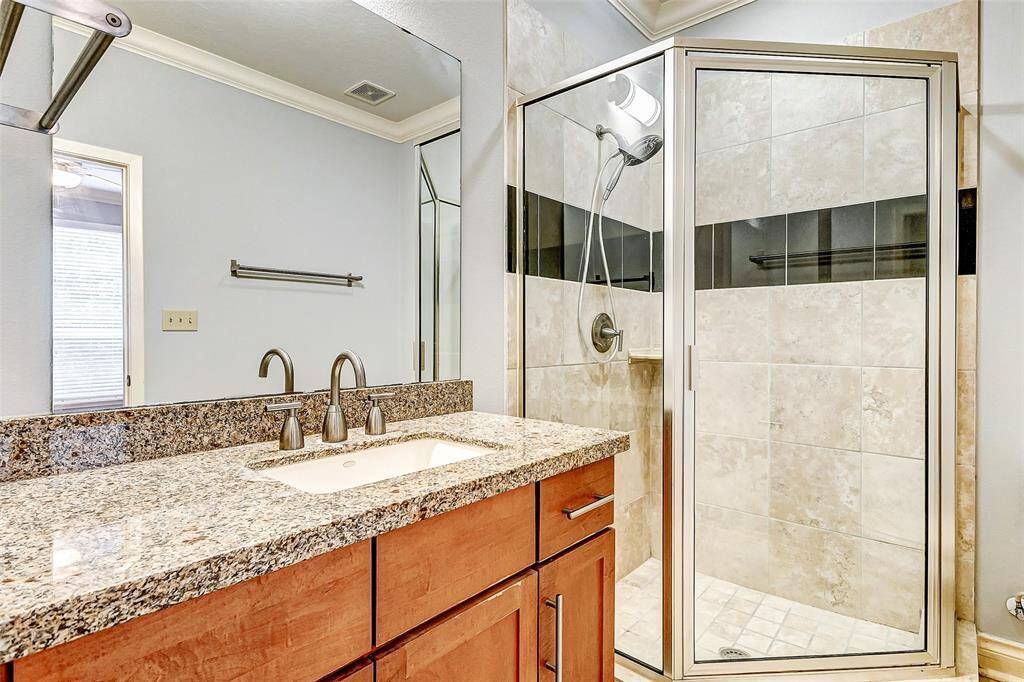 Connected to the guest room isa full guest bath with a singlevanity with granite counter tops and large walk in shower.