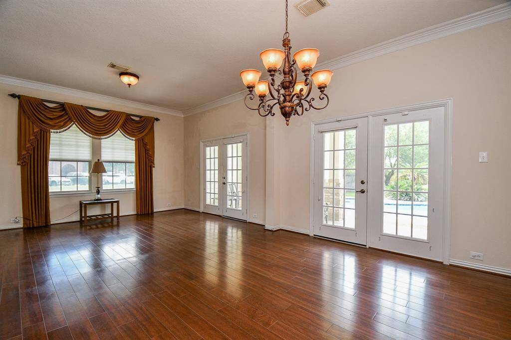 Formal dining/living room combo leading out to the pool area