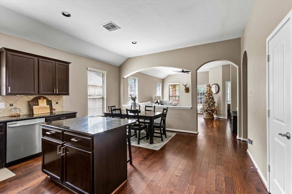 Open Concept with some division between dining and living
