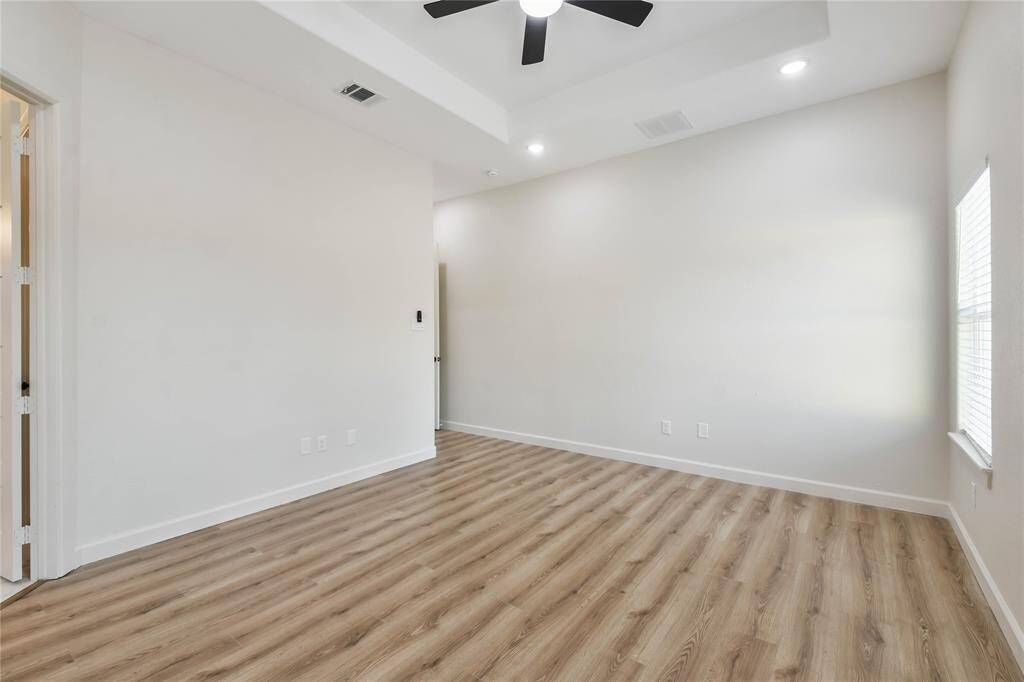 Wood look tile flooring and base boards--no carpet.