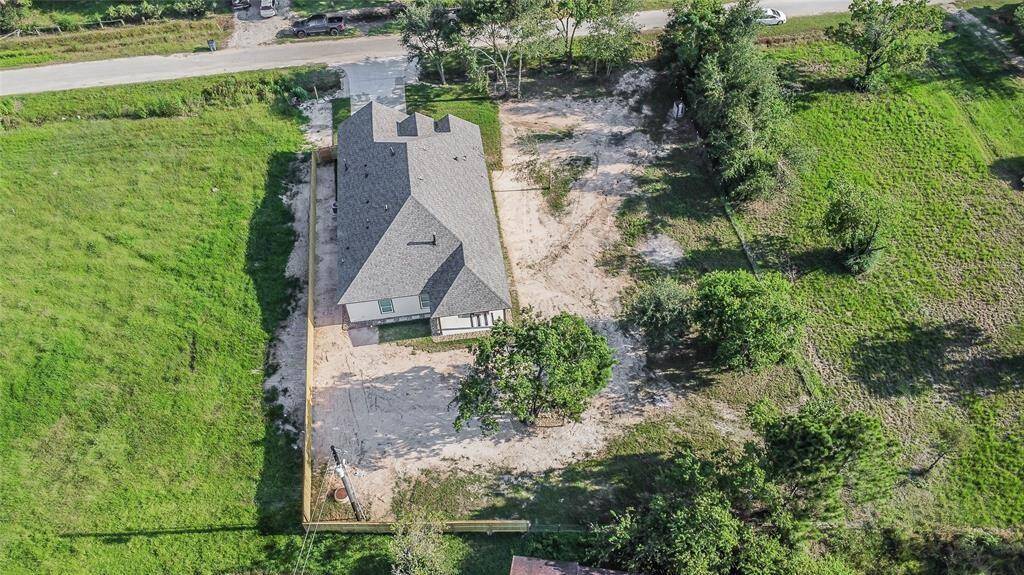 This new home built on a large lot on a quiet street in Waller offers Texas living with lots of privacy and quiet.
