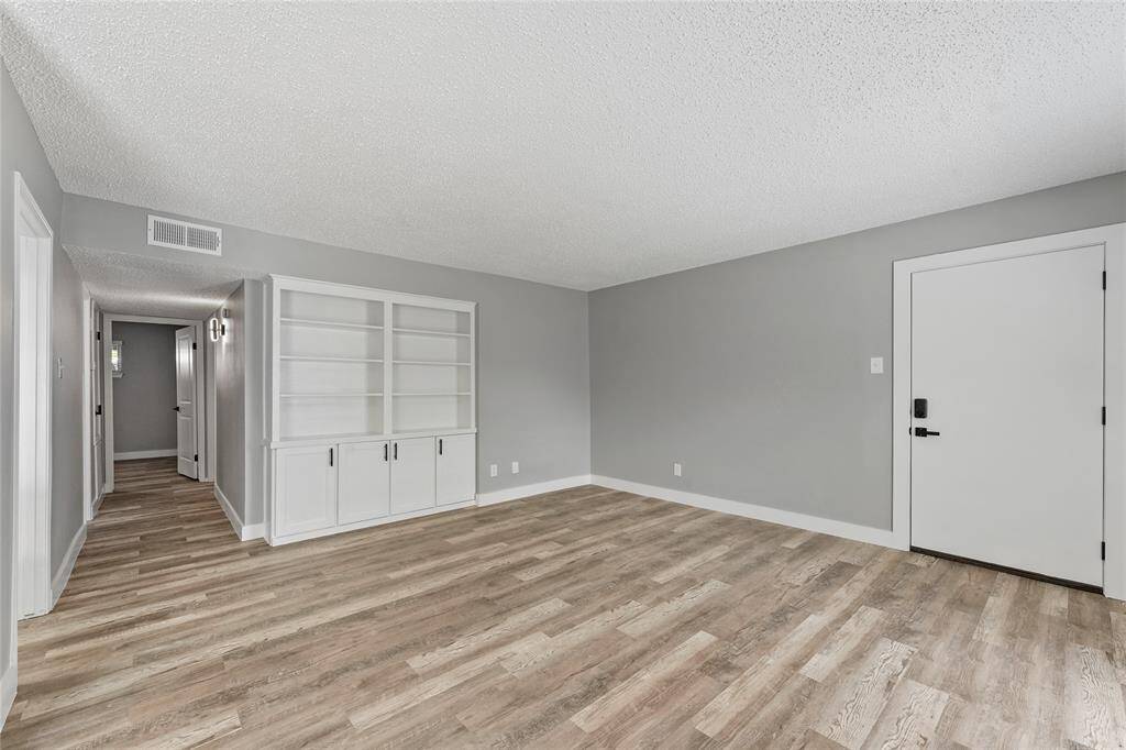 View from living area with beautiful built in shelving.