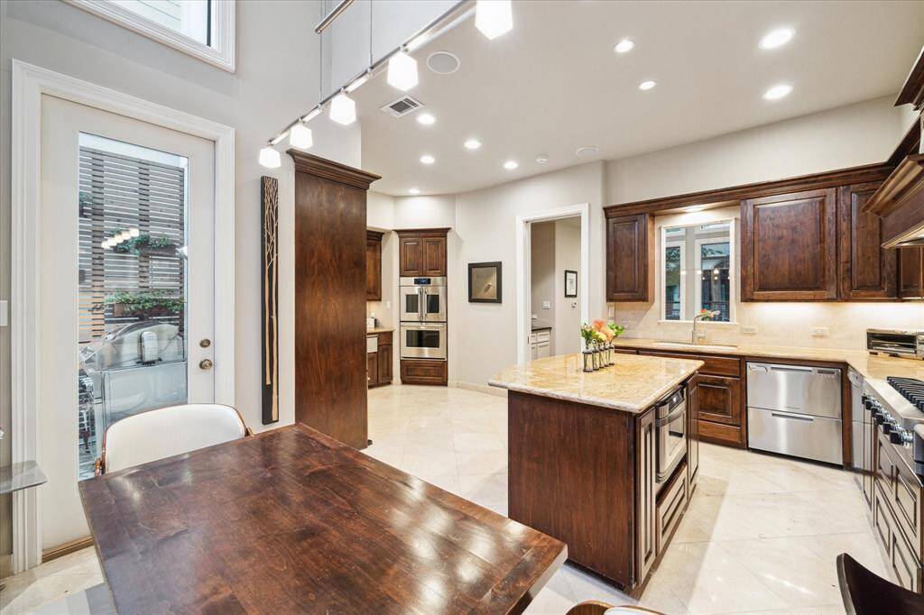 Alternate view of expansive kitchen showcasing breakfast nook.