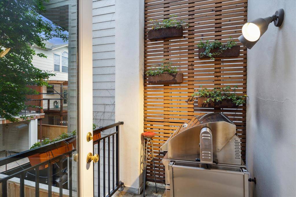 Kitchen balcony for ease of grilling and overlooking pond.