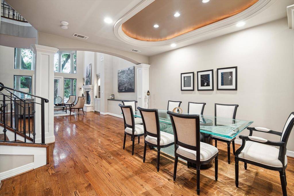 An inviting formal dining with extended seating lined with buffet, built ins and cabinetry storage.