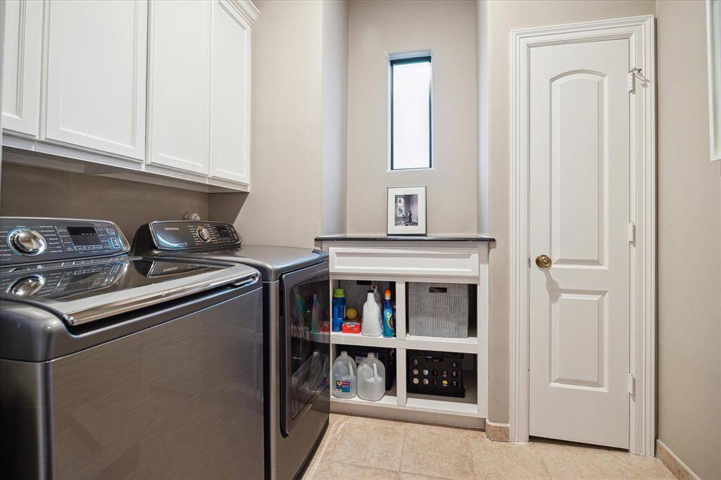 A full utility room - Washer and dryer to stay. Not in view is dog wash station.