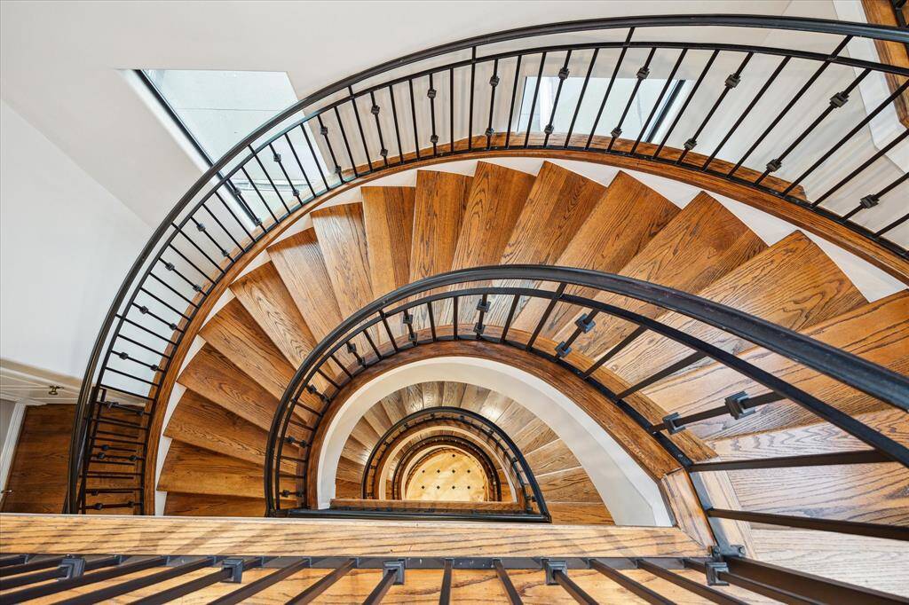 A masterful spiral staircase that ushers you through six stunning floors.