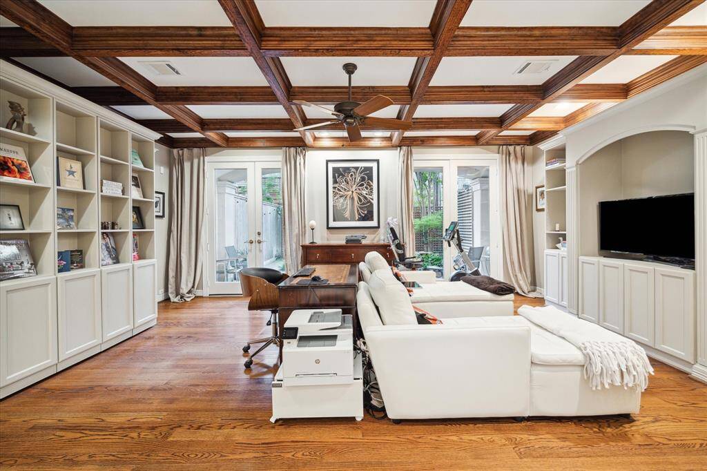 A transitional first floor space with custom built in murphy bed providing for an ideal office and guest suite with full en suite bath. Mill work and ceiling detail wrap this room in elegance. French doors lead to an outdoor retreat equipped with serene pond and covered porch.