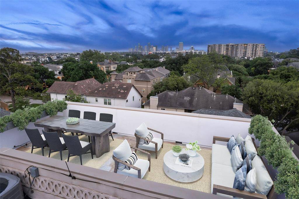 High above the hustle and bustle that is Houston tucked away in the The Camp Logan Tree House steps from Memorial Park. (Digitally staged terrace.)