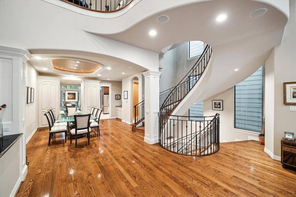 A view into inviting formal dining lined with buffet, built ins and cabinetry storage.